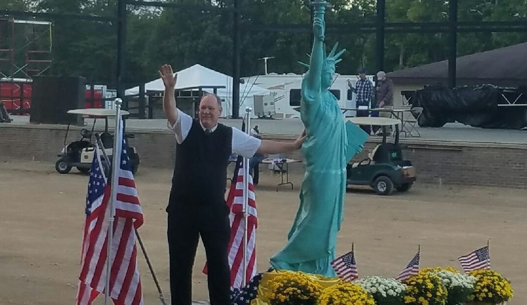 Bill Gelineau passes Grandstand at Allegan County Fair Parade. Photo By Mary Buzuma.