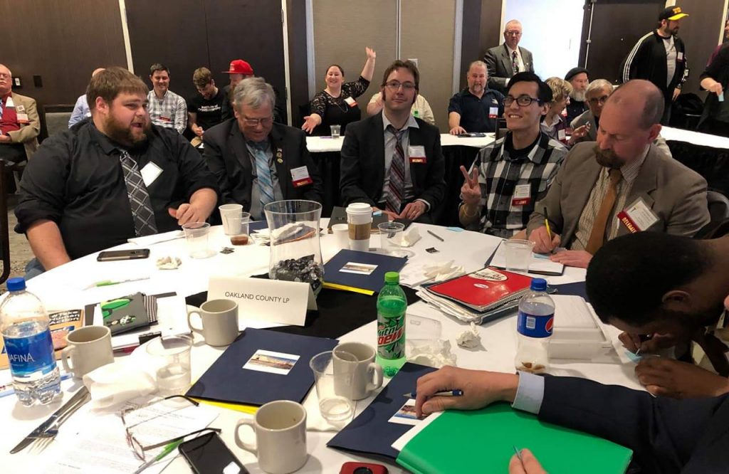 Delegates socialized at round tables at the 2019 Bay City State Convention.
