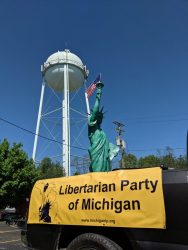 The LPOC's giant aluminum Statue of Liberty rides aboard Paul Vainer’s truck at the Sylvan Lake Memorial Day Parade. Photo by Greg Stempfle.