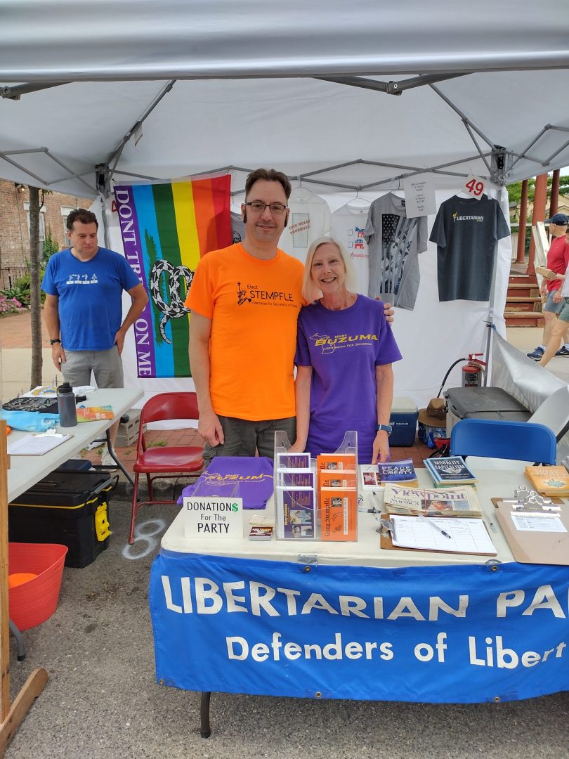 Secretary of State Candidate Greg Stempfle and Governor Candidate Mary Buzuma at the Ann Arbor Art Fair Outreach Booth.