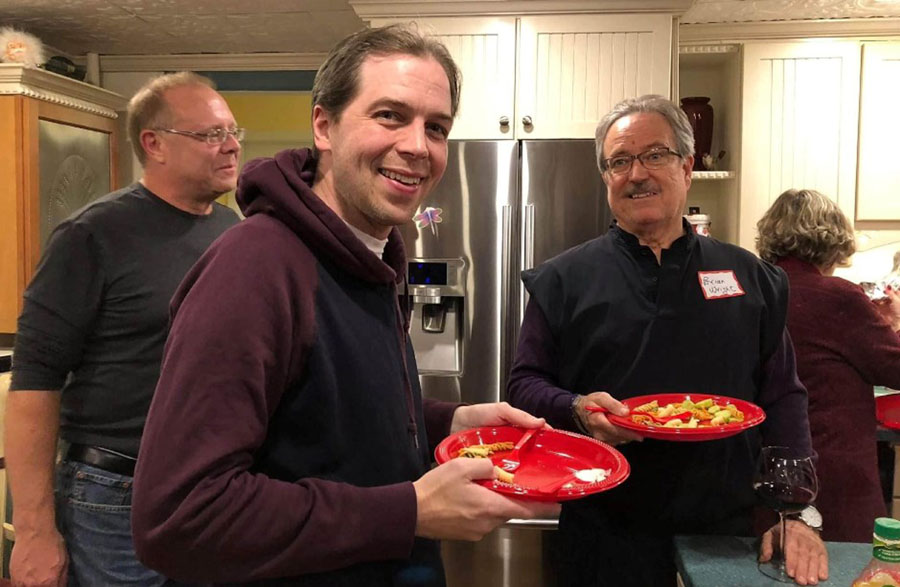 Brian Wright (Right) at the Oakland County Libertarian's Christmas Party in 2017. Others: Kevin Kangas (Left), Matt Karshis (Center) and hostess Diane Szabla (Back turned). Photo by Claranna Gelineau